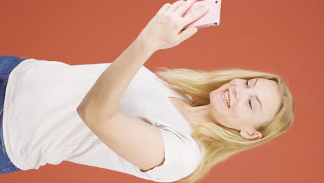 Vertical-video-of-Woman-making-a-video-call-on-the-phone.